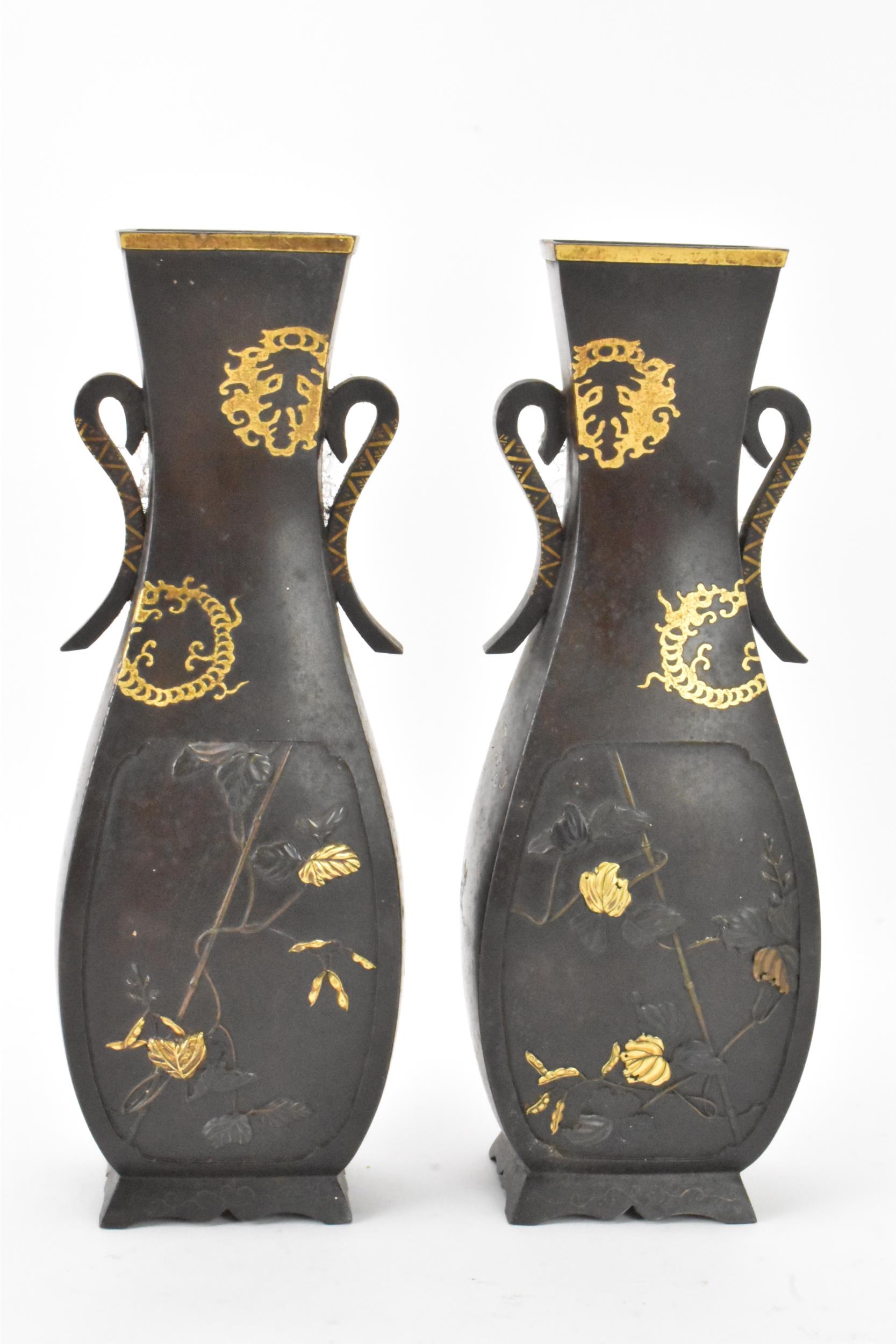A pair of Japanese Meiji period iron vases, decorated with panels depicting birds and flowers in - Image 3 of 6