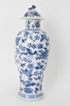 A Chinese Qing dynasty blue and white lidded vase, late 19th/early 20th century, decorated with
