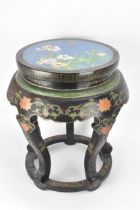 A Chinese 20th century occasional table, having a black lacquered frame supported by five curved