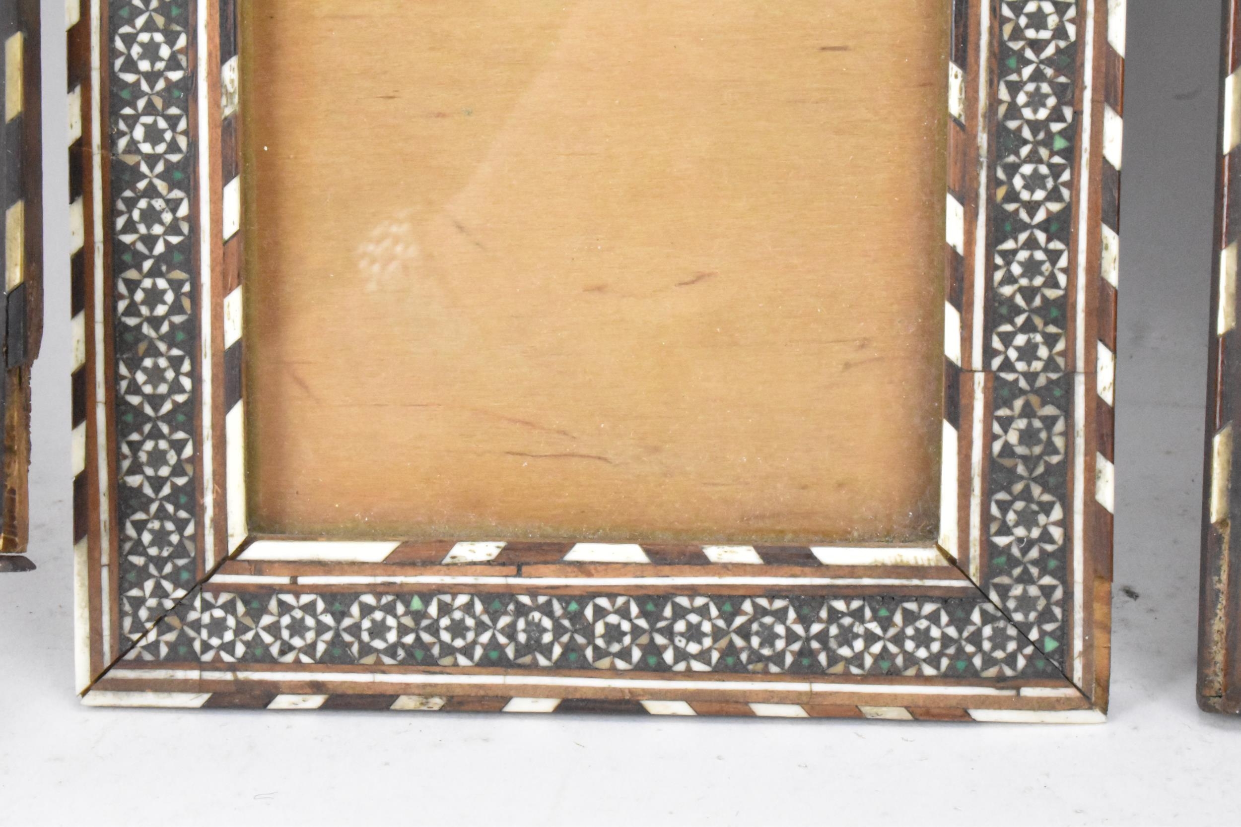 Three similar Persian late Qajar dynasty photograph frames, the profusely inlaid frames having - Image 9 of 14