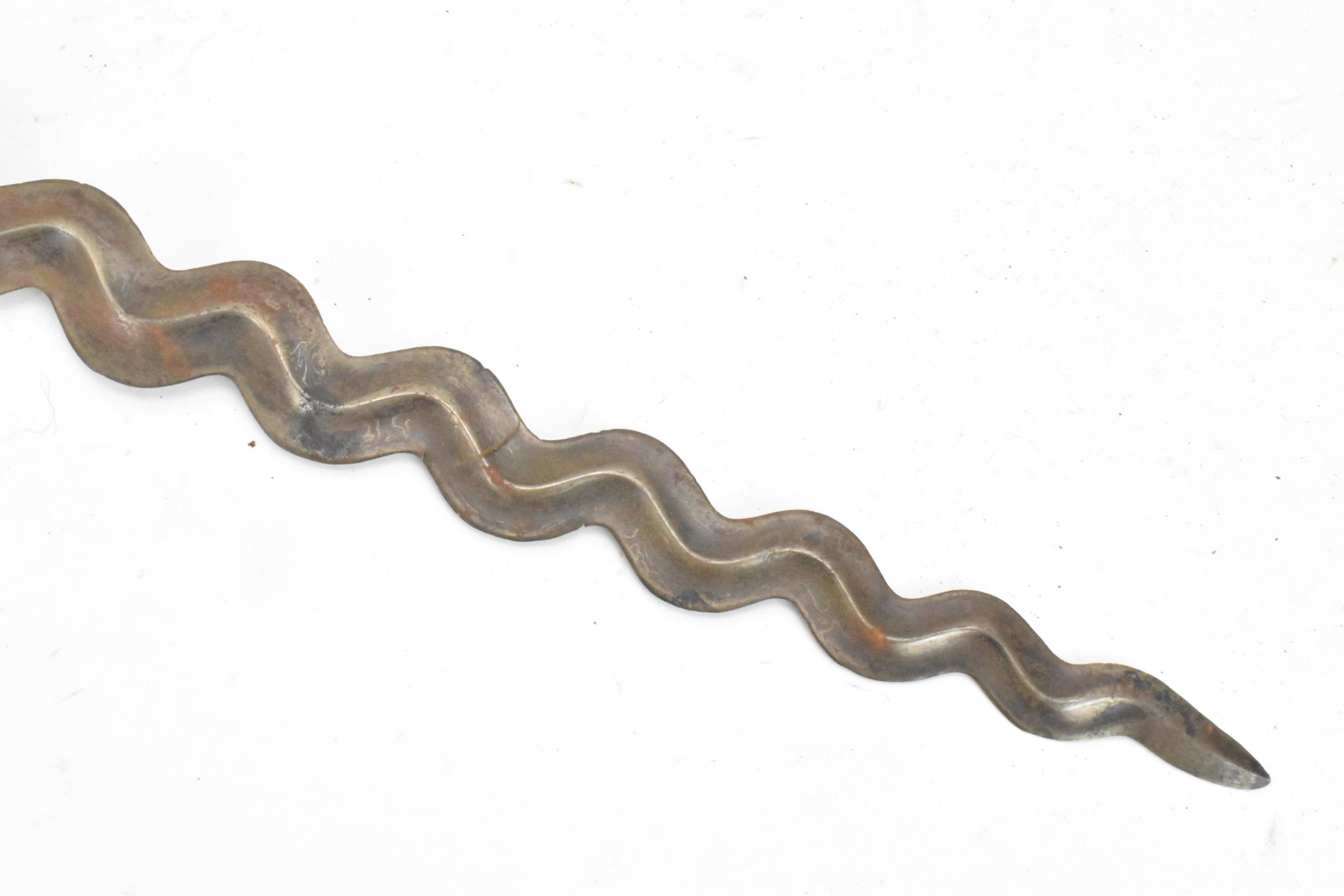 A 19th century Malayan Kris or Keris, having a double edged wavy blade with undulations, raised - Image 6 of 8