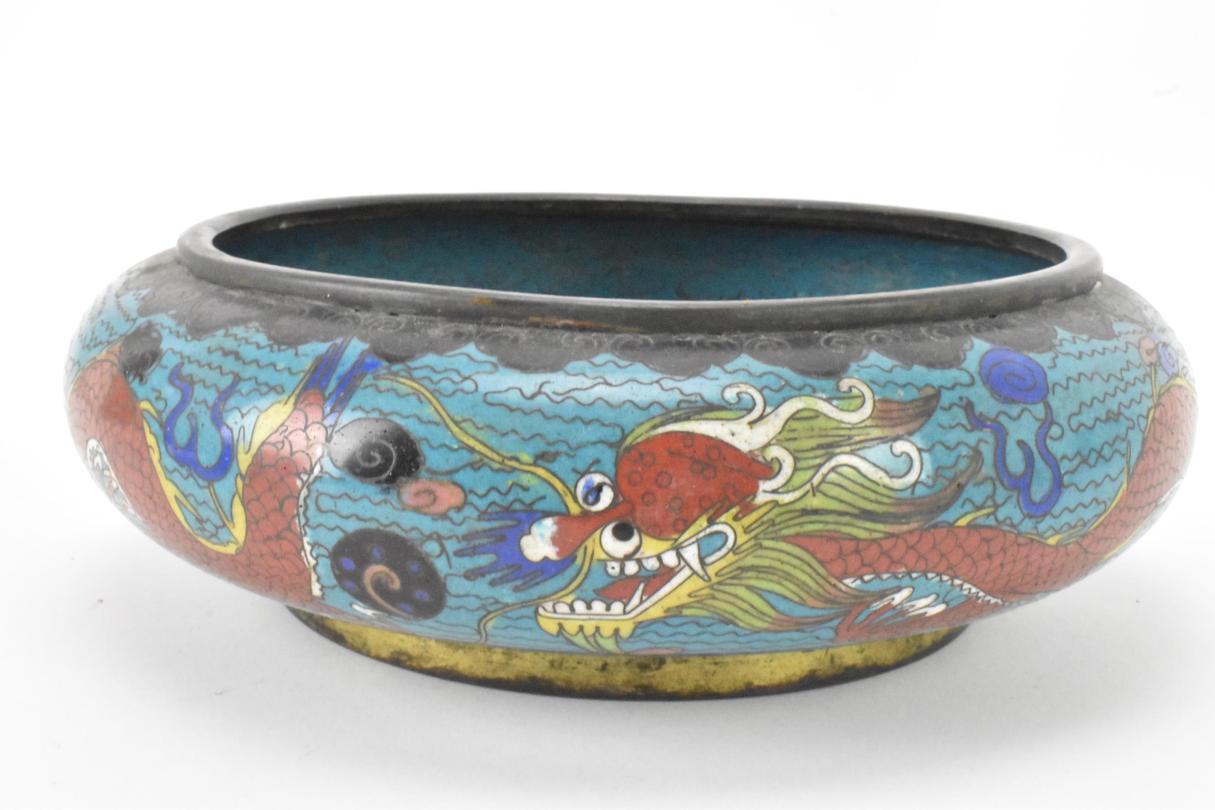 A Chinese cloisonne bowl, late 19th/early 20th century, of shallow form, decorated on a blue - Image 4 of 6