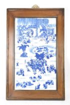 A mid 20th century Chinese blue and white porcelain panel depicting scenes of children at play among