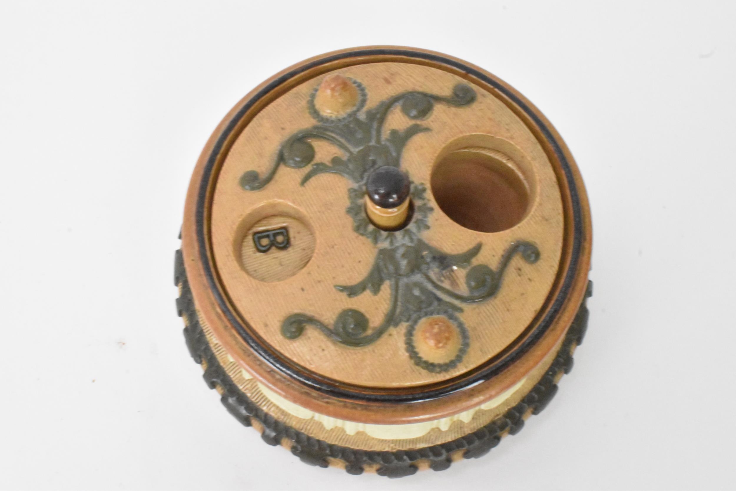 A rare and unusual Doulton stoneware container, possibly an inkwell with revolving lid, the well - Image 5 of 10