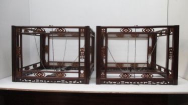 A pair of 19th century Chinese tielimu and boxwood hanging lanterns, carved and fretworked with