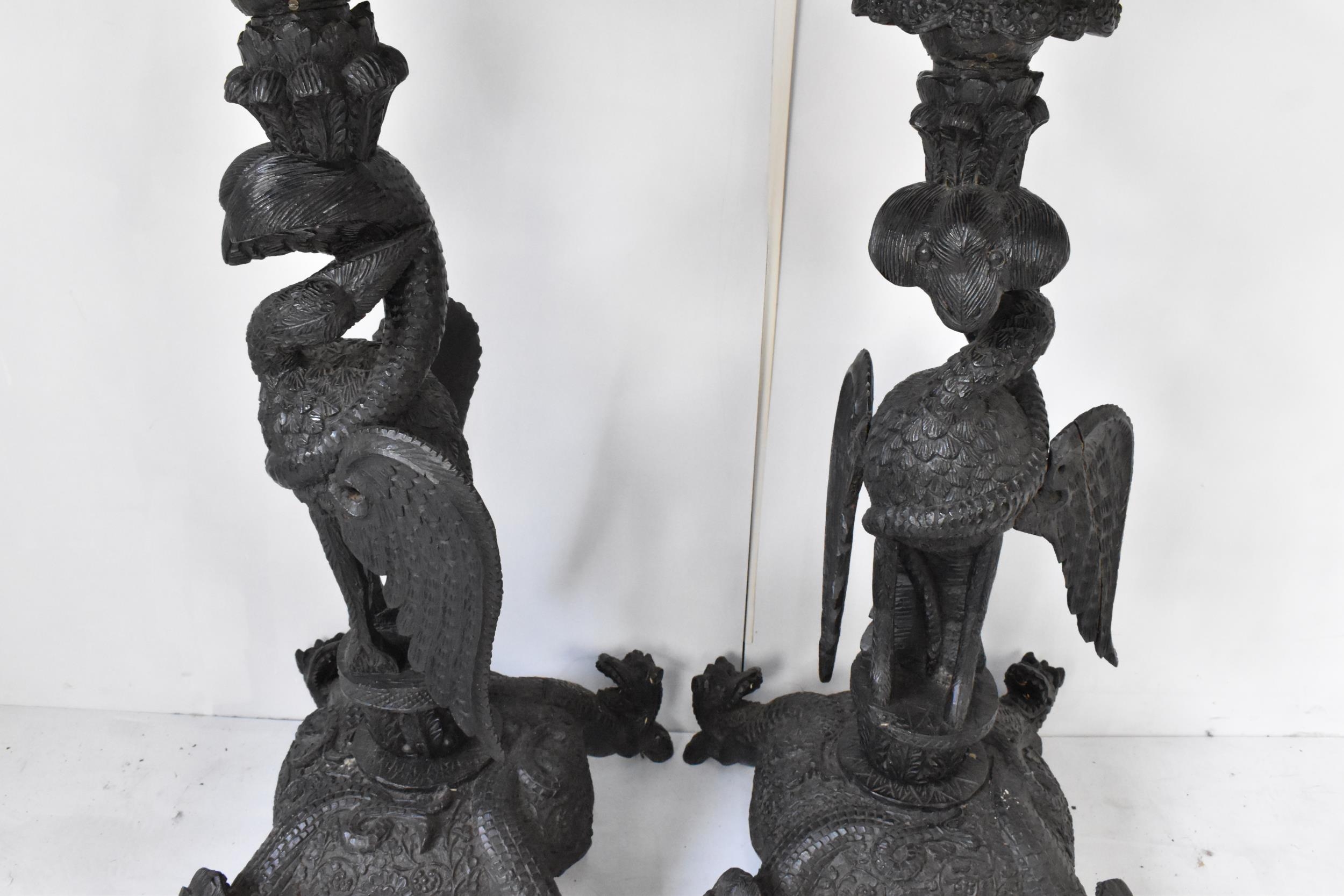 A pair of late 19th century Anglo-Indian colonial ebonized carved plant stands, each having ornately - Image 3 of 5
