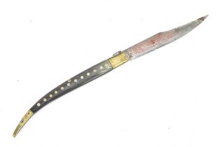 A 19th century Spanish Navaja folding dagger, with brass and animal horn grip, the acid etched blade