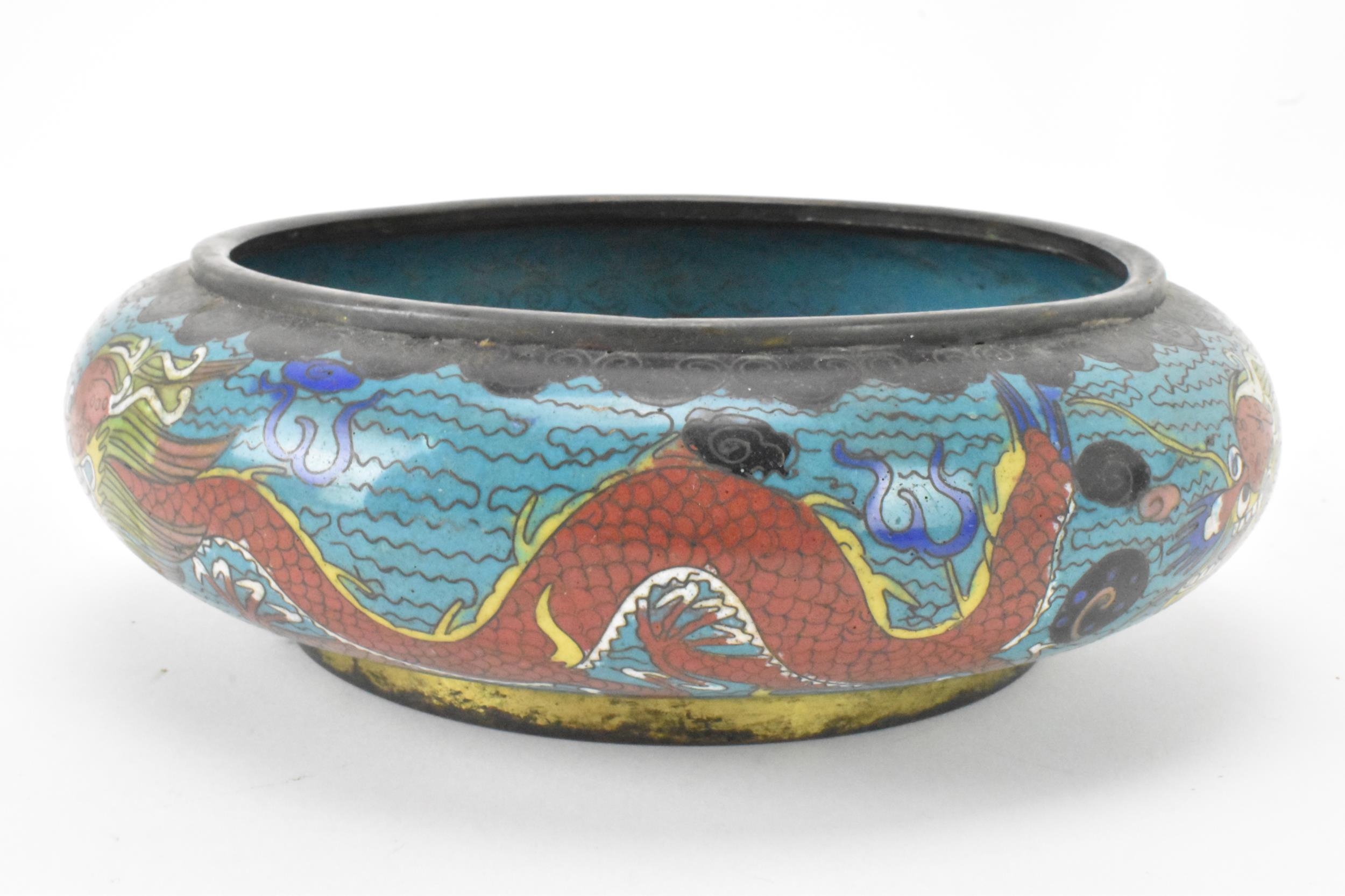 A Chinese cloisonne bowl, late 19th/early 20th century, of shallow form, decorated on a blue - Image 3 of 6