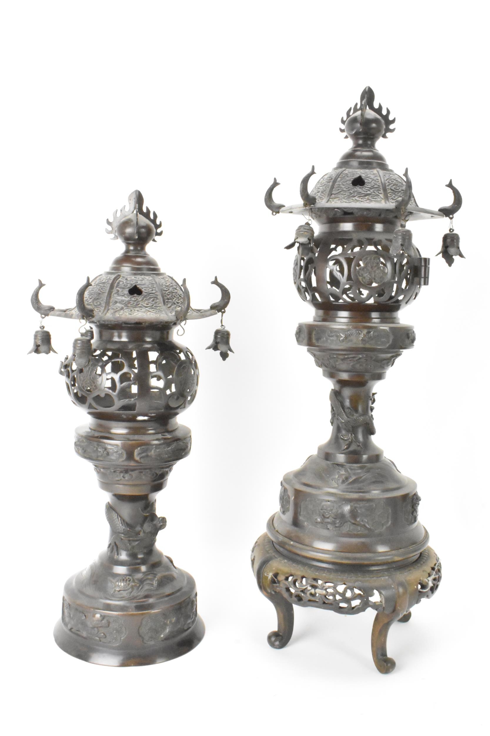 A pair of Japanese Meiji period bronze koros in the form of temples with pagoda roof with bells,