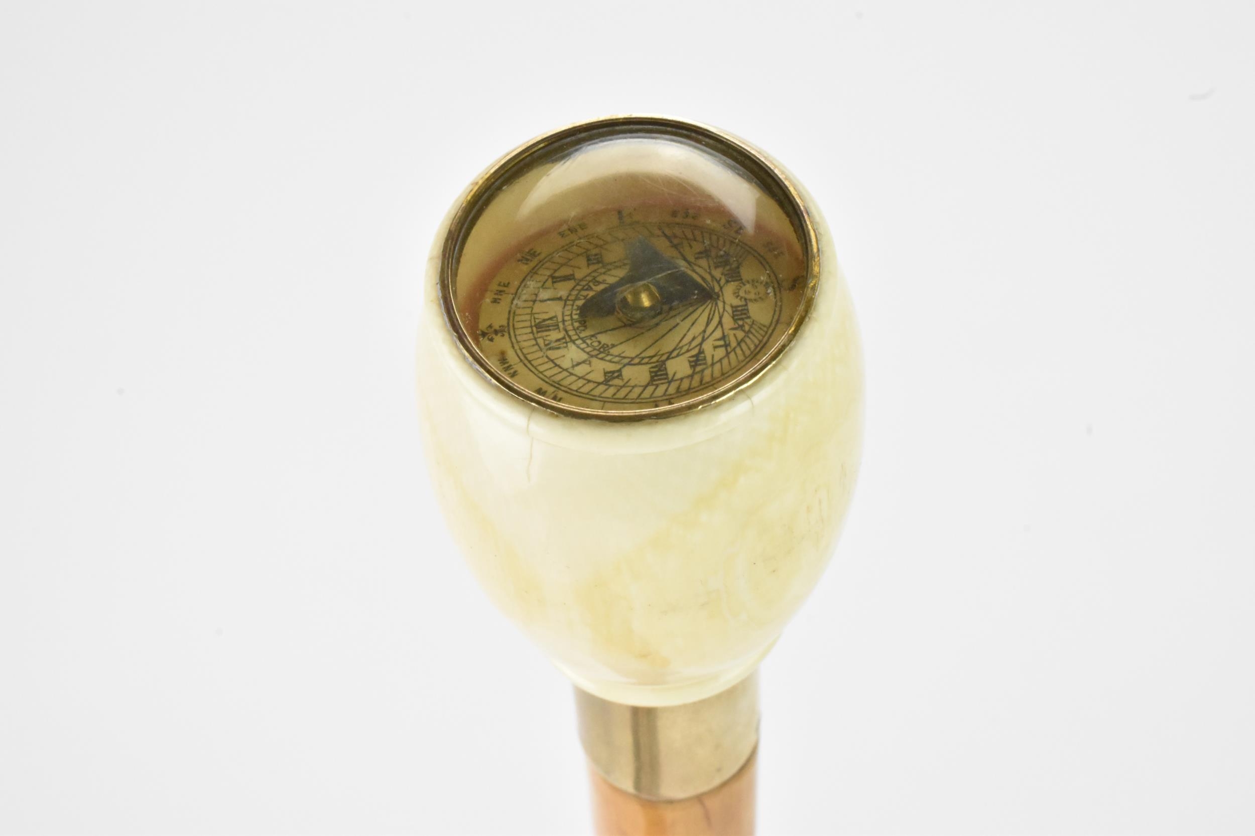 A late 19th/early 20th century walking stick, with an ivory knop handle inset with a compass, nickel - Image 2 of 5