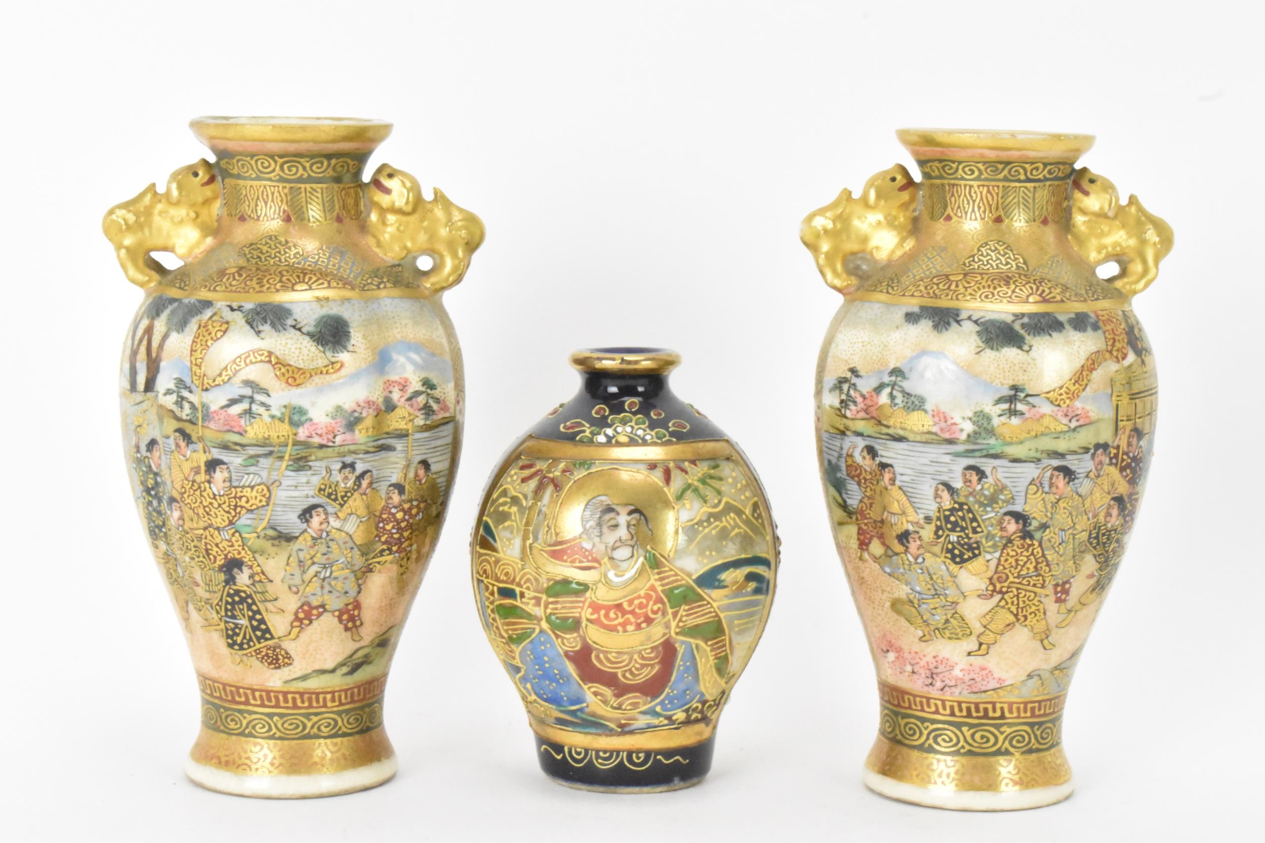 A pair of Japanese Meiji Satsuma miniature vases and a later example, the pair of tapered form,