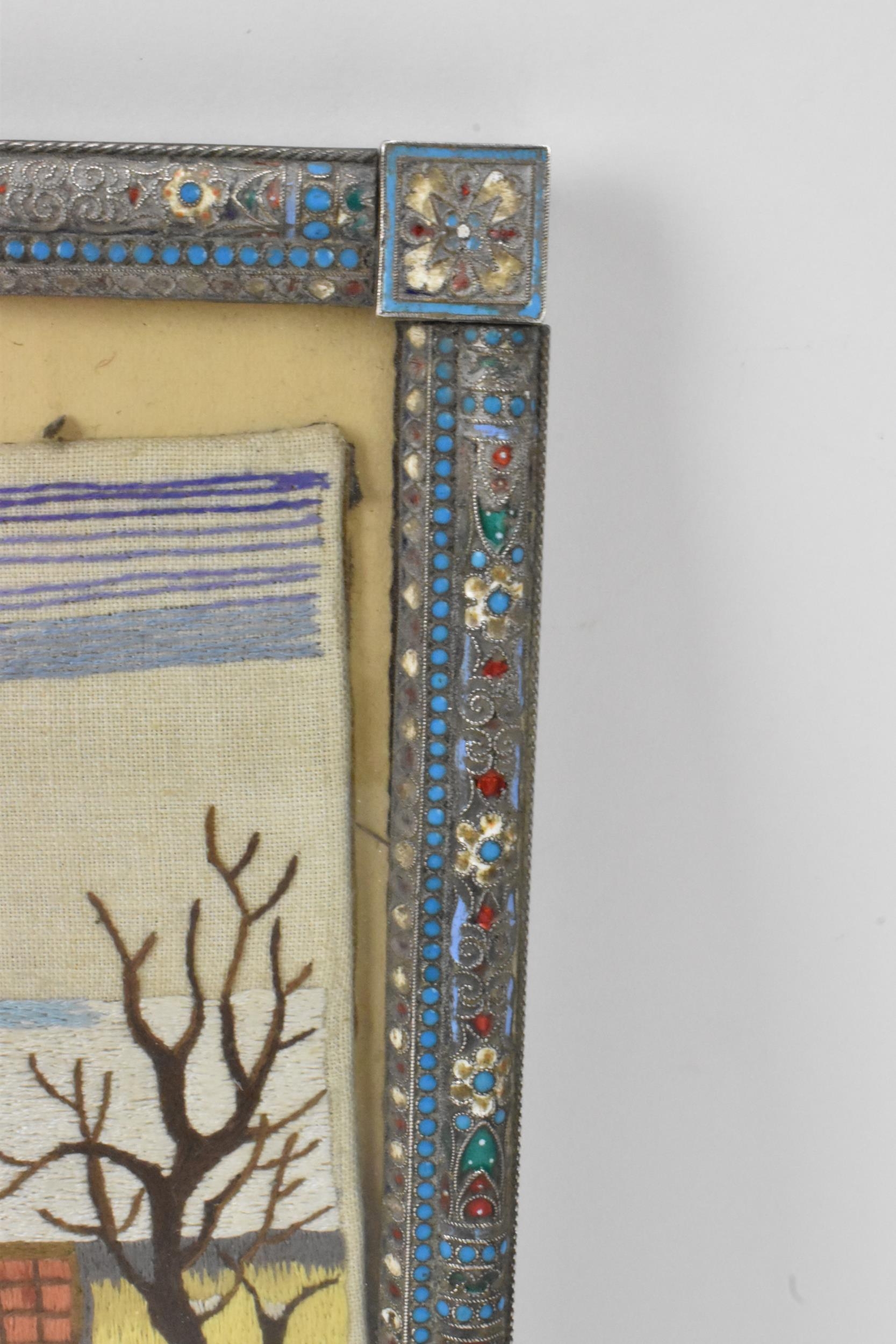 A Russian silver early 20th century champleve enamel photograph frame, inset with a tapestry and - Image 3 of 15