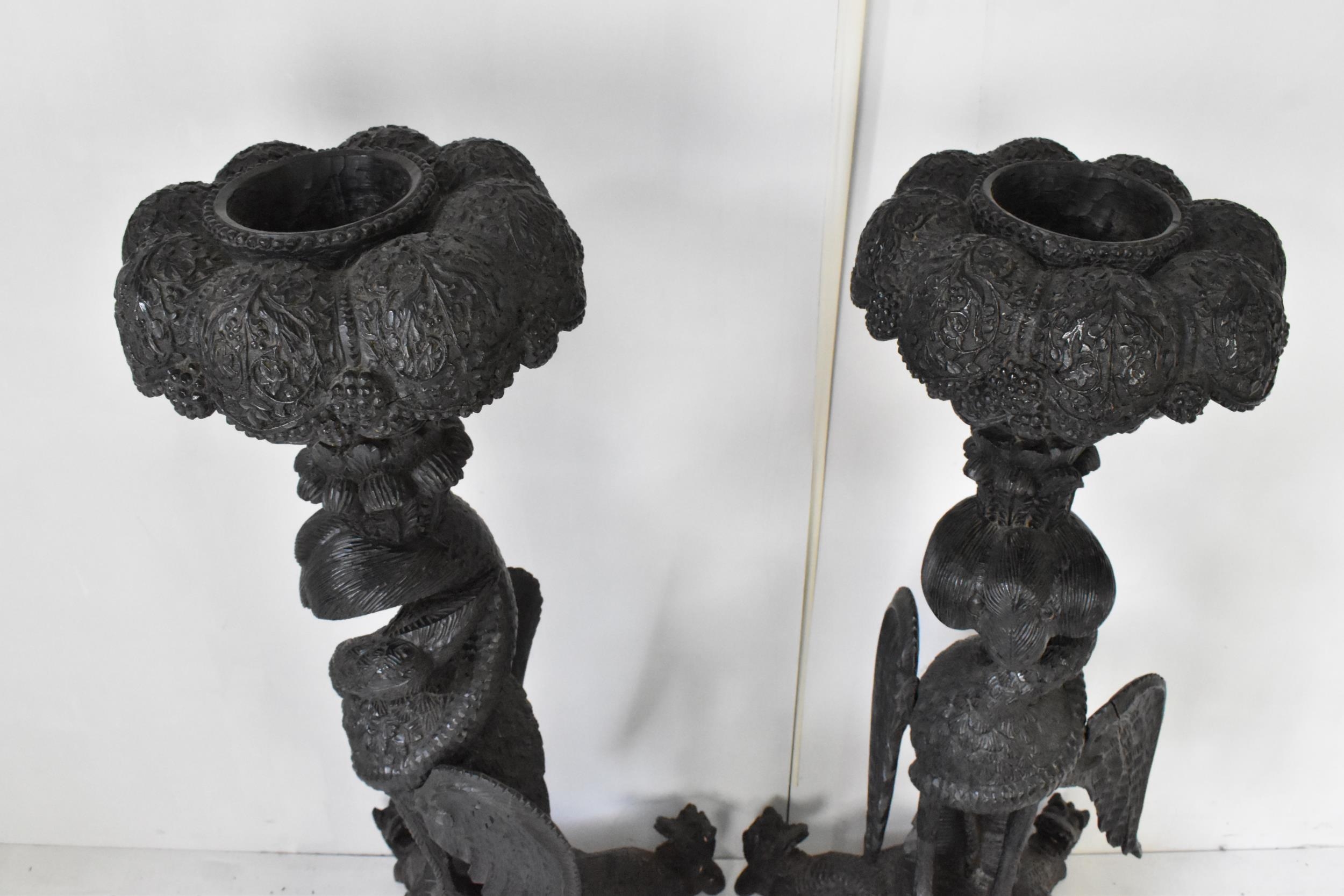 A pair of late 19th century Anglo-Indian colonial ebonized carved plant stands, each having ornately - Image 2 of 5