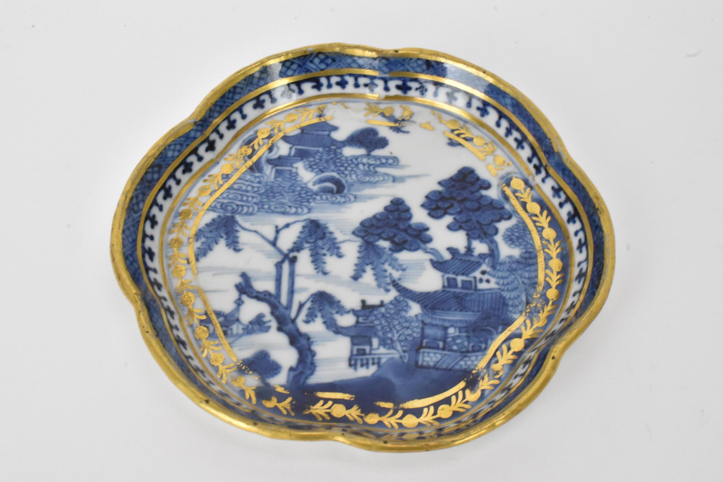 A Chinese export Qing dynasty blue and white teapot and stand, late 18th century, decorated with - Image 10 of 11