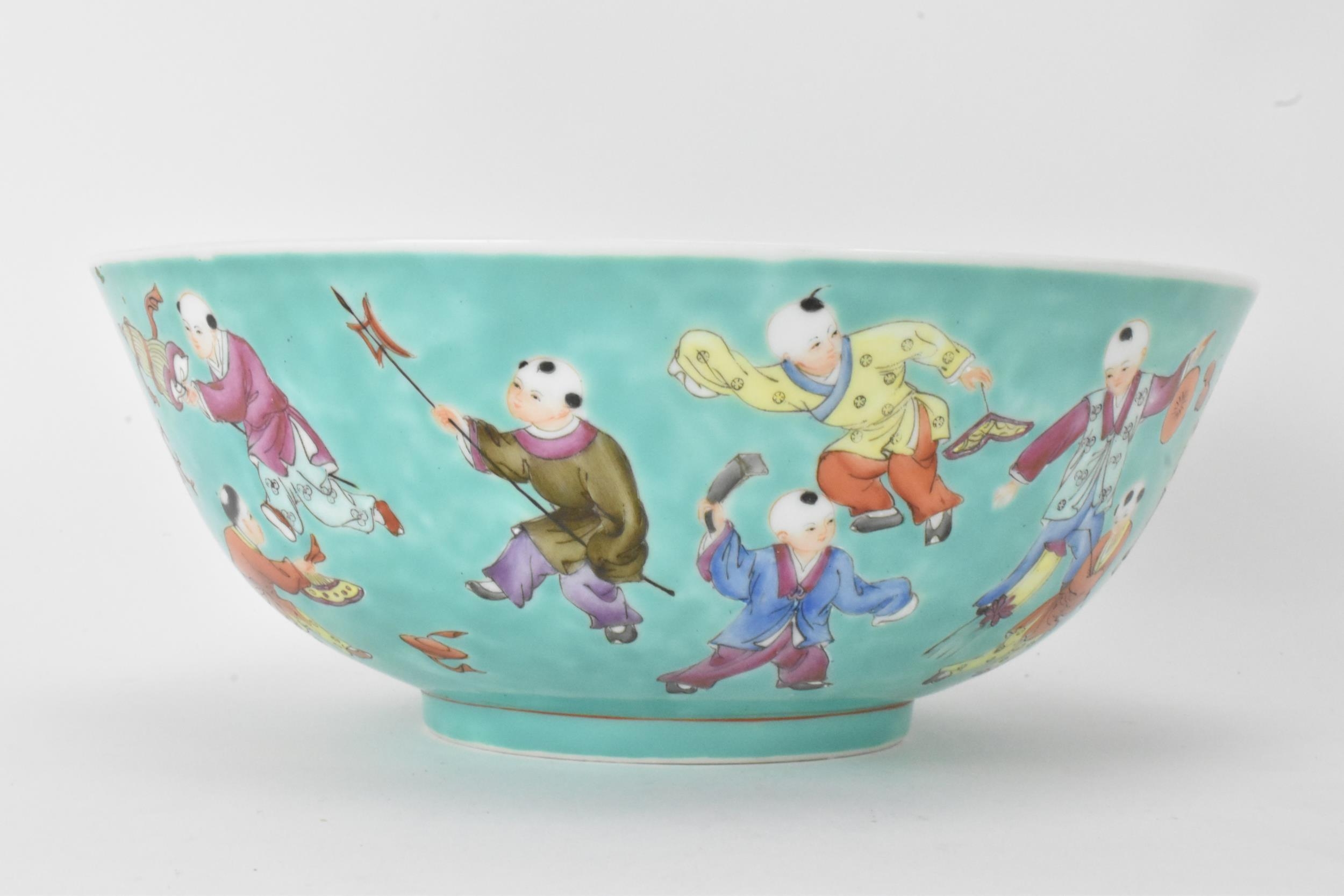 A Chinese Famille Rose porcelain bowl, on a turquoise ground and decorated in various enamels