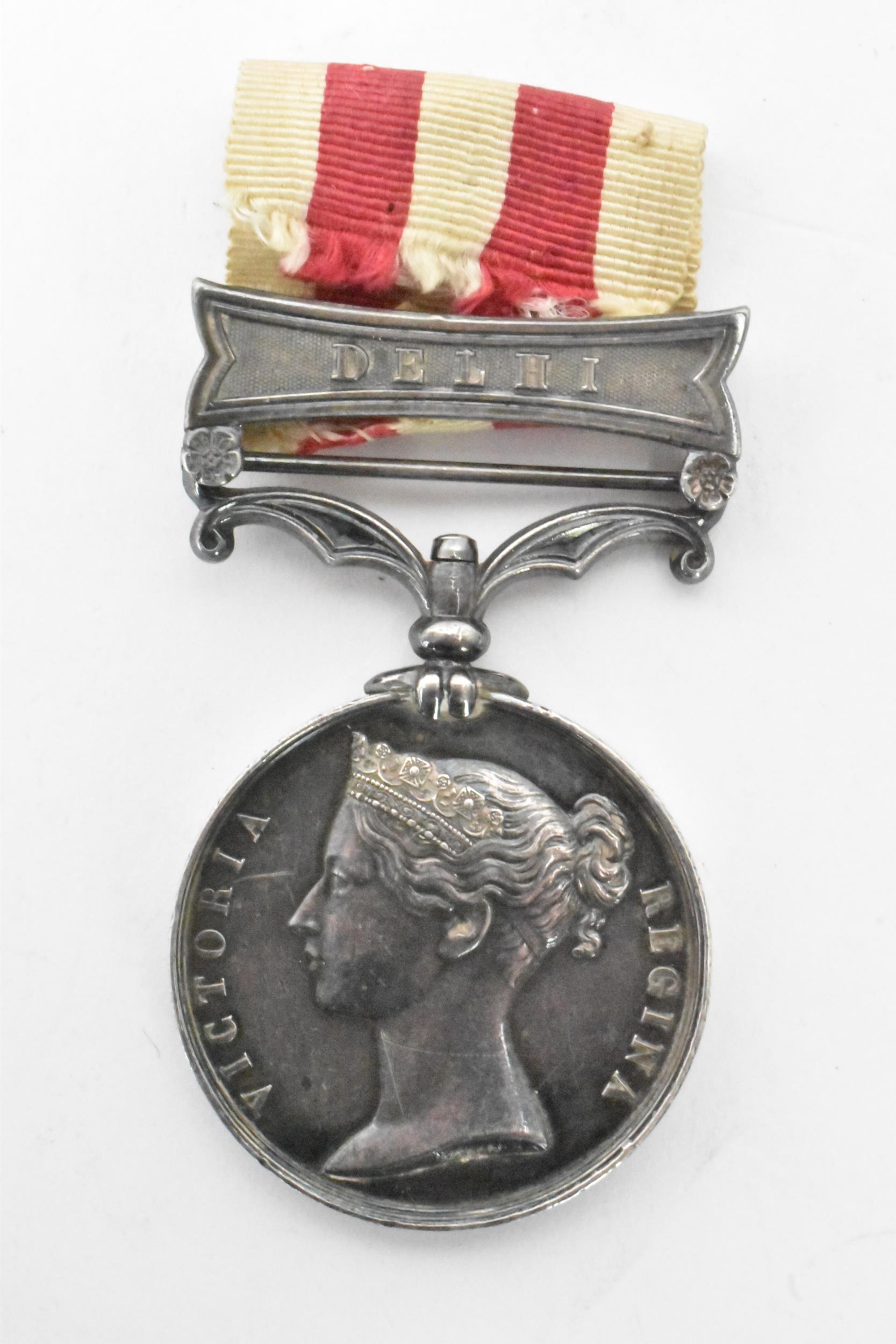 A Victorian Indian mutiny medal, 1857-58, with Delhi clasp, awarded to CORPL D,DIX 61ST REGT