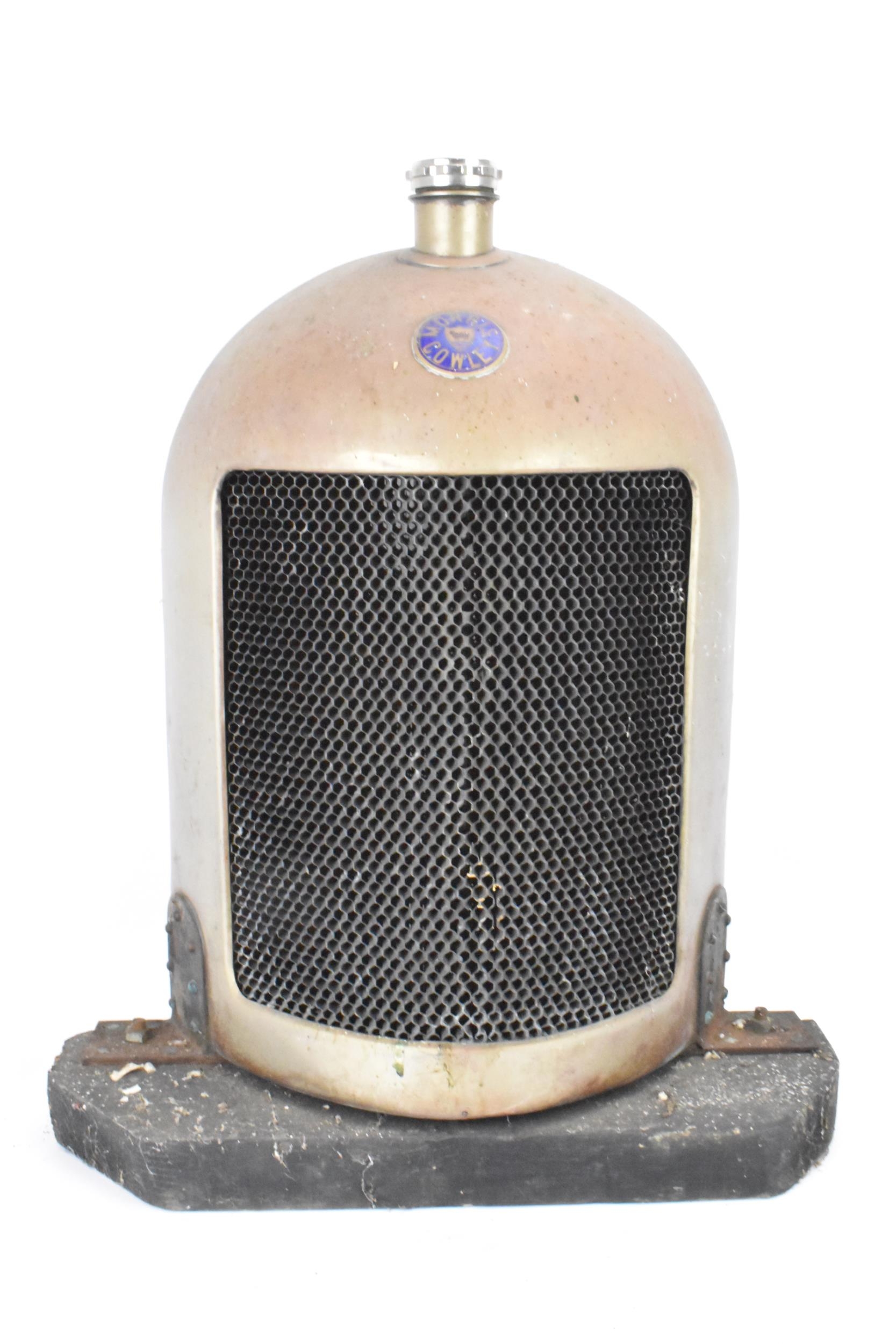 A Morris Cowley 'Bullnose' radiator, circa 1920s, nickel plated surround with blue enamel badge, a