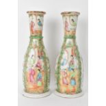 A pair of Chinese late 19th century Canton Famille Rose vases, of cylindrical tapered form, the