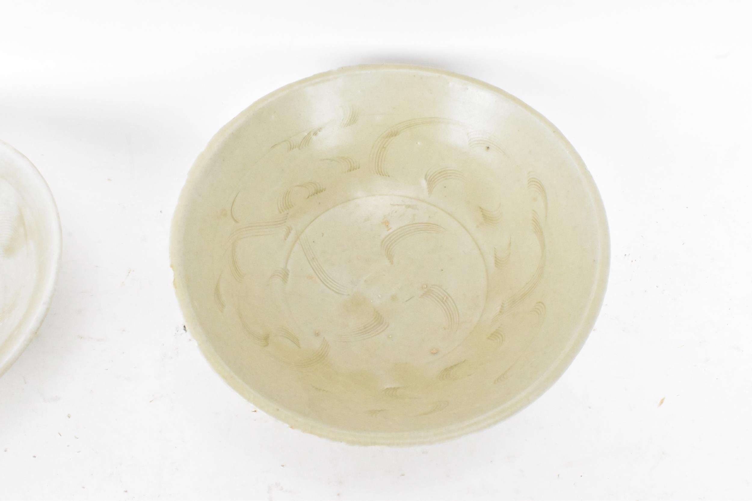 Two Chinese Song dynasty (960-1279) celadon glazed bowls, from a shipwreck in the South China - Image 2 of 5