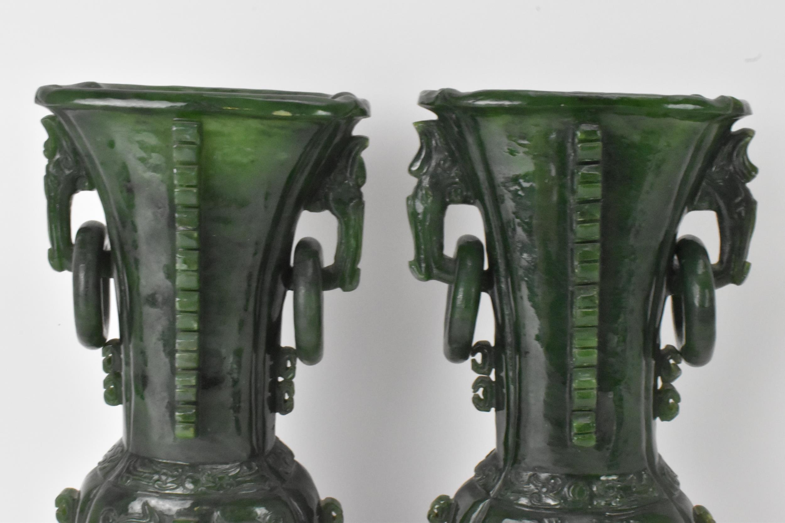 A pair of Chinese 20th century jadeite vases, of flattened baluster shape with archaistic relief - Image 2 of 7