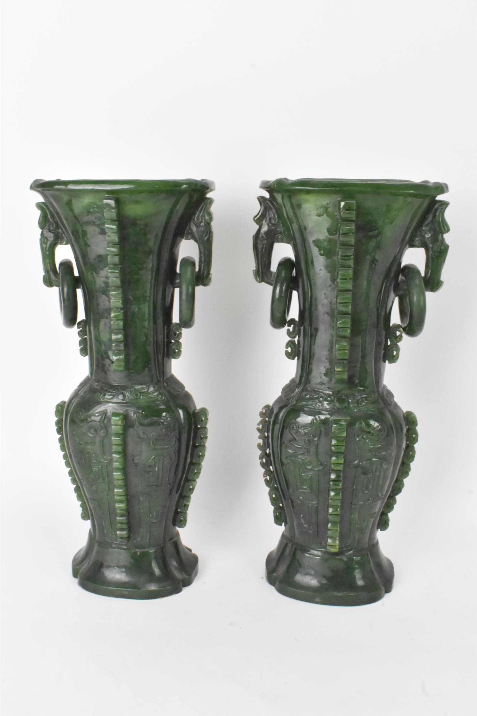 A pair of Chinese 20th century jadeite vases, of flattened baluster shape with archaistic relief - Image 5 of 7