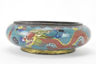 A Chinese cloisonne bowl, late 19th/early 20th century, of shallow form, decorated on a blue