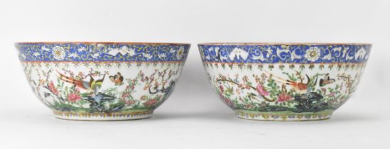 A near pair of Chinese export Canton famille rose punch bowls, Qing dynasty, late 19th century,