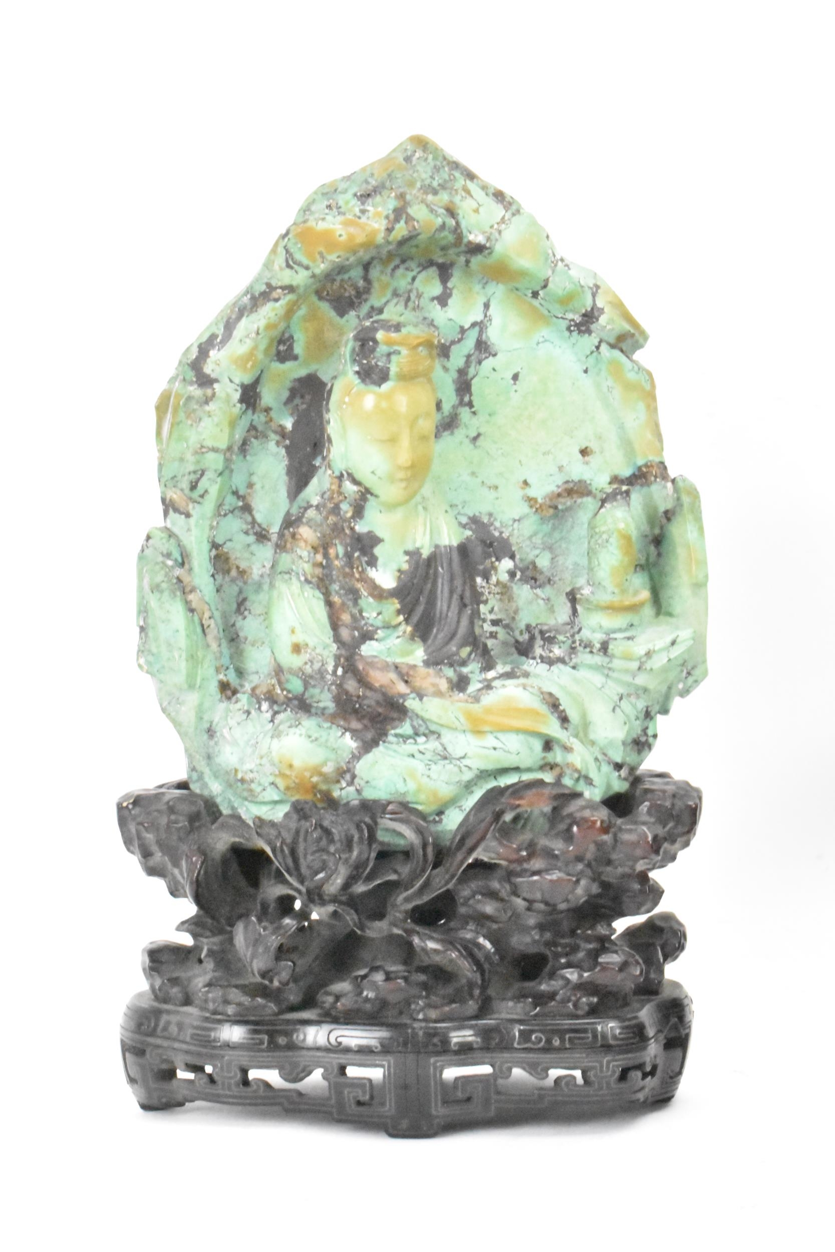 An early/mid 20th century Chinese turquoise carved figure of Guanyin, the goddess of mercy, mounted