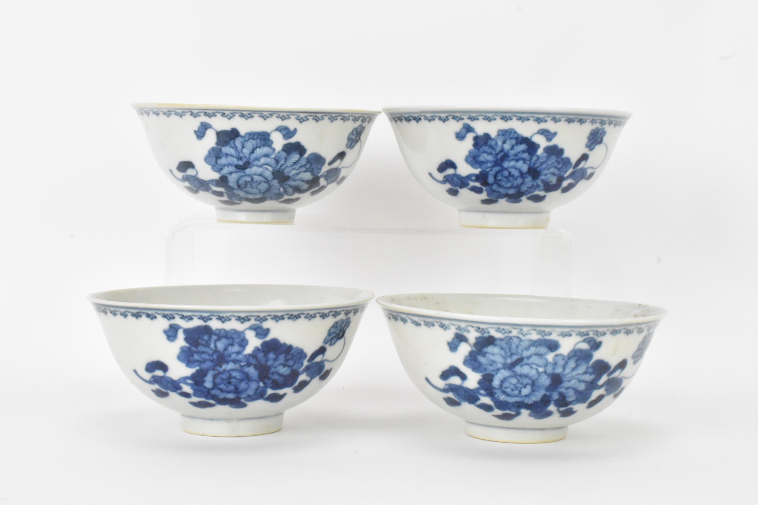 A set of four Qing dynasty, Guangxu period blue and white porcelain bowls, with floral decoration,