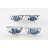 A set of four Qing dynasty, Guangxu period blue and white porcelain bowls, with floral decoration,