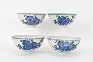 A set of four Qing dynasty, Guangxu period blue and white porcelain bowls, with floral decoration,