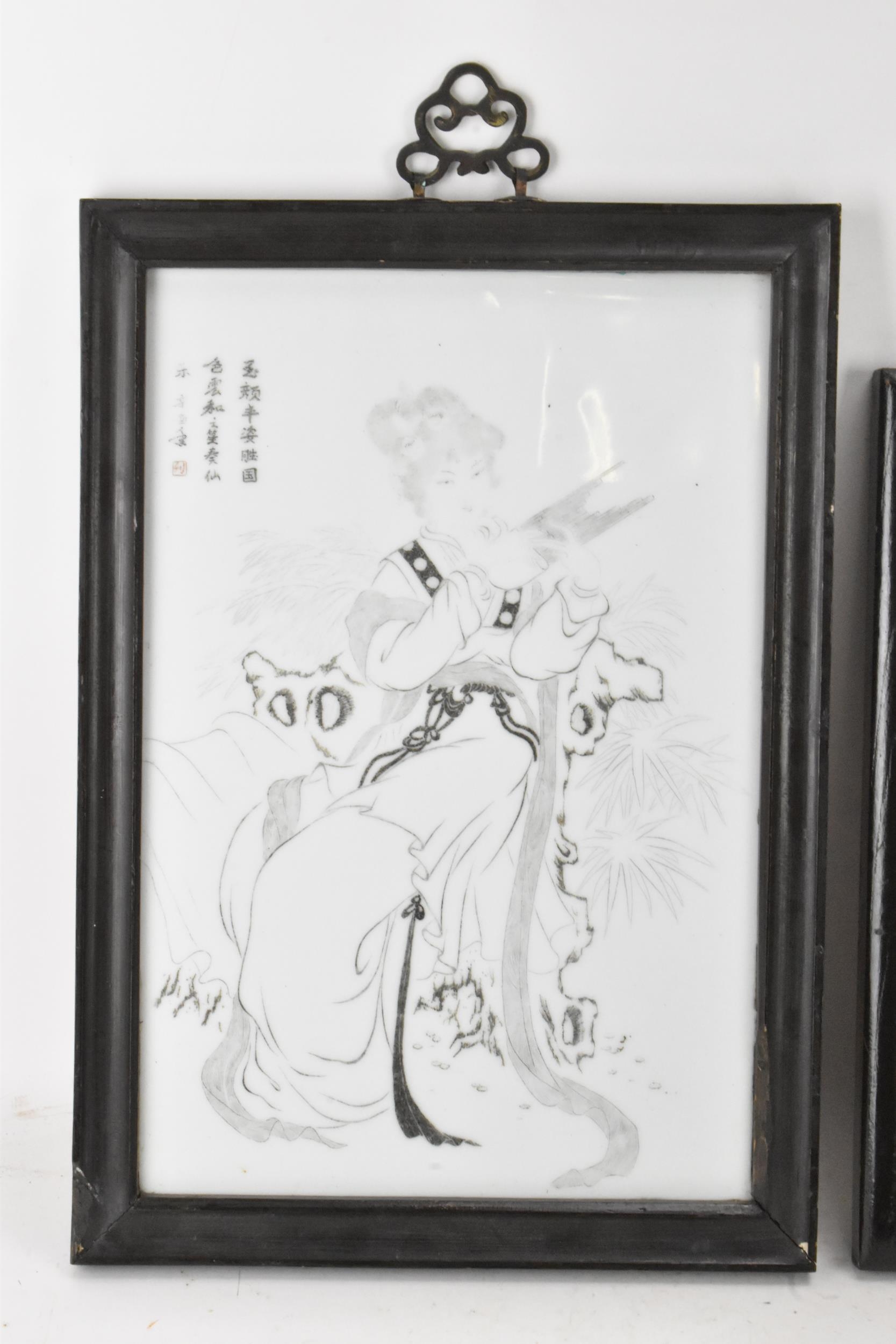 Two 20th century Chinese porcelain framed panels to include one depicting two dancing figures with - Image 2 of 9