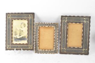 Three similar Persian late Qajar dynasty photograph frames, the profusely inlaid frames having