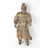 A Chinese carved and painted wood figure of a warrior, late Ming/Qing dynasty, in traditional