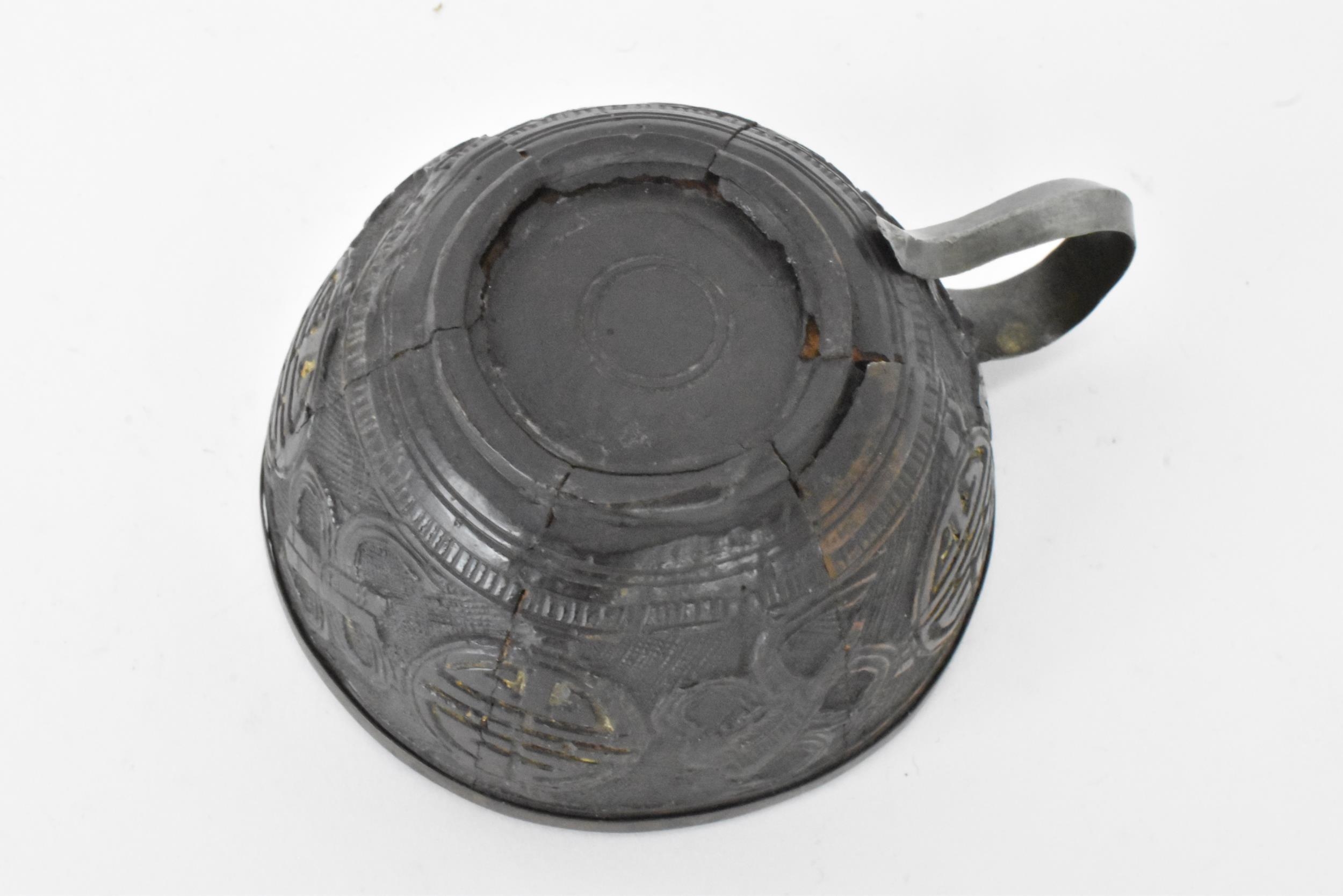 A Chinese late 19th/early 20th century coconut carved cup and saucer, both with pewter liners and - Image 6 of 8
