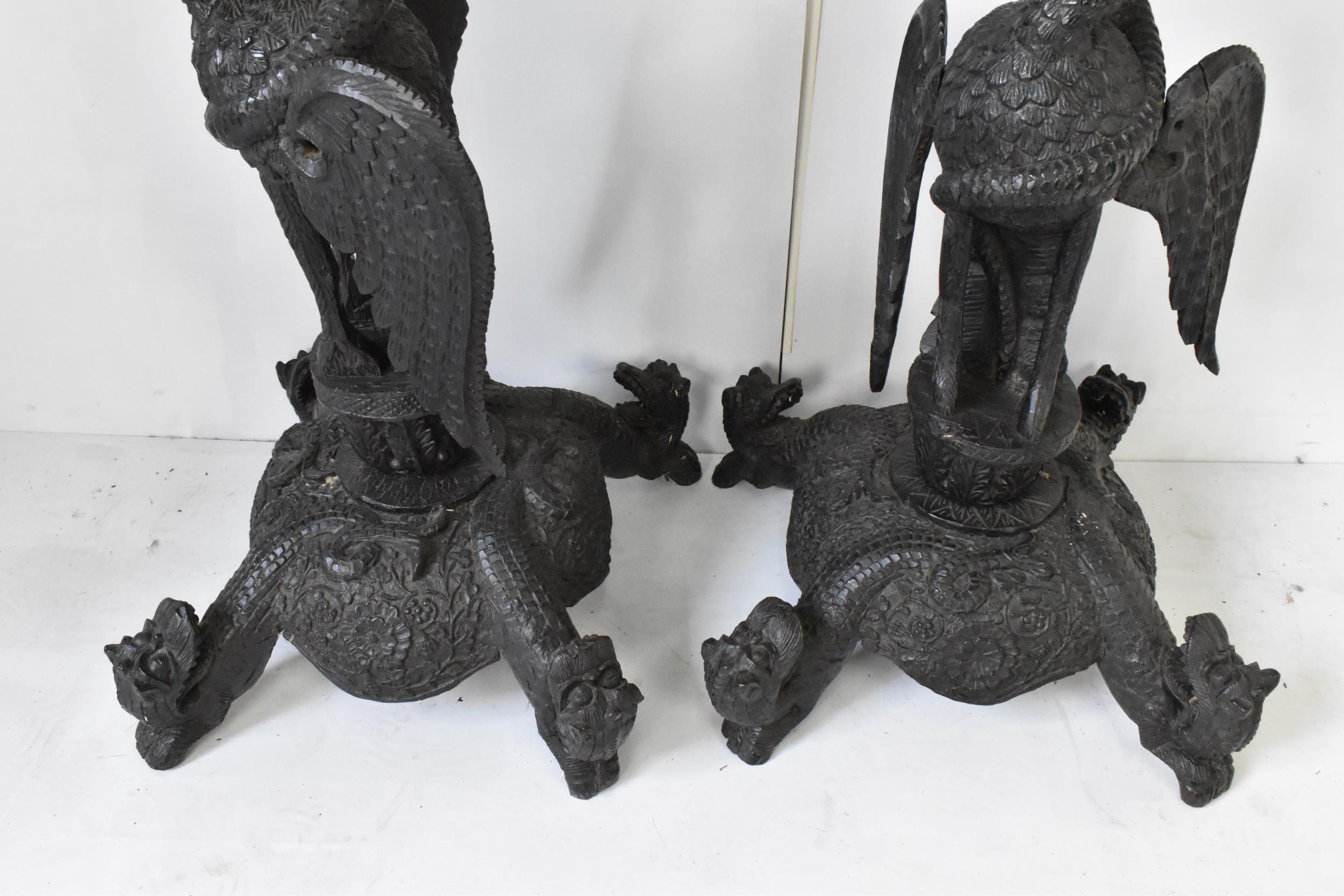 A pair of late 19th century Anglo-Indian colonial ebonized carved plant stands, each having ornately - Image 4 of 5