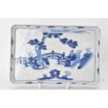 A 19th century Chinese blue and white tray, of rectangular shape and painted with a scene of two