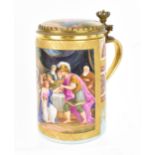 A brass-mounted Royal Vienna porcelain tankard, of cylindrical form painted with a figurative