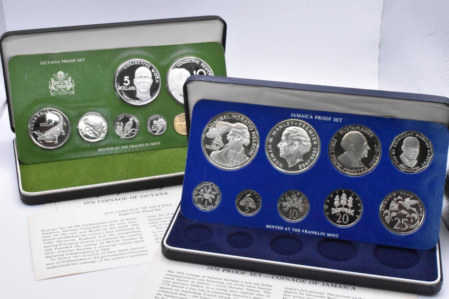 Proof Coin Sets - A pair of 1976 Franklin Mint sets comprising of Jamaica 9-Coin example to