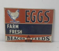 A late 20th century Beacon feeds farm fresh eggs enamel advertising sign 41cmW x 28.5cmH Location: