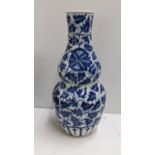 A Chinese late Qing dynasty blue and white double gourd vase, with apocryphal Xuande mark to the