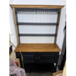 A 1930s part painted oak dresser with shelves above two doors and pot shelf below 194cm x 120cm x