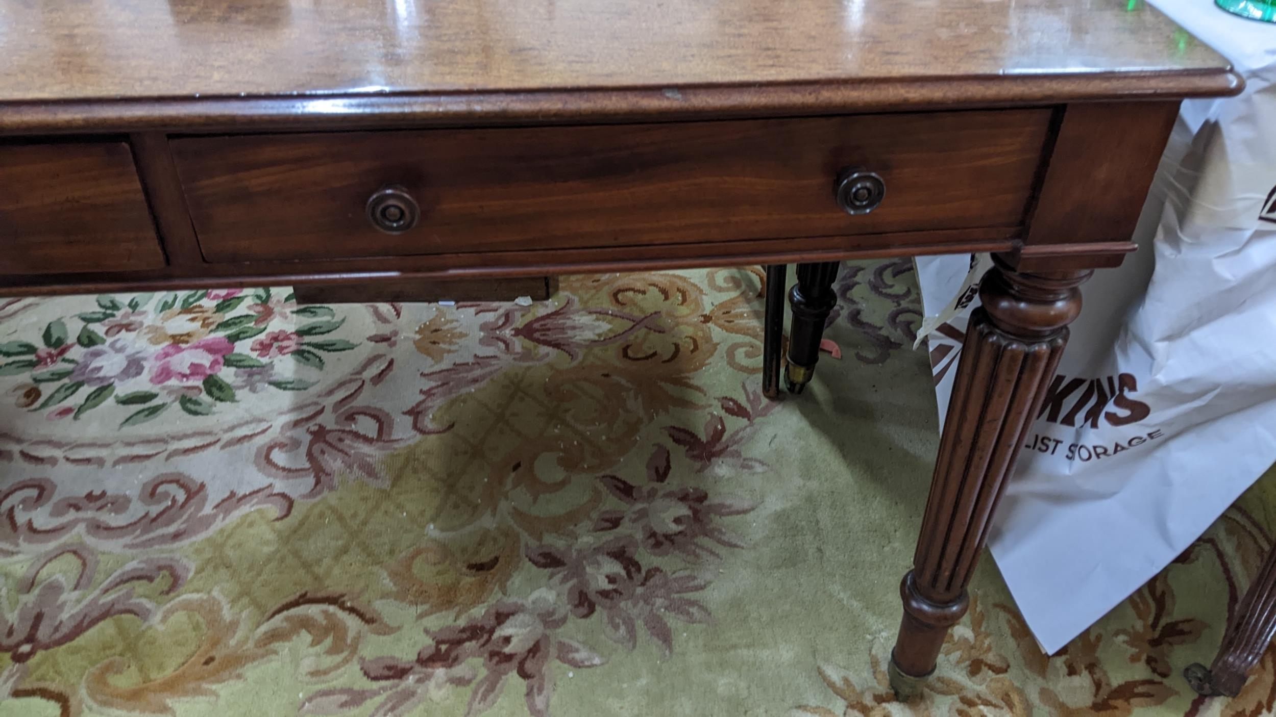 A late Victorian Warring & Gillows style side table having two short drawers and reeded tapering - Image 4 of 5