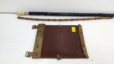 Militaria to include a swagger stick, an Irish walking stick inscribed SGT A Batsford and a map case