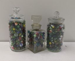 A variety of Victorian and later marbles, housed in three glass jars Location: If there is no