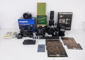 Olympus cameras, equipment and photography accessories to include two Olympus OM-2s, an Olympus OM-