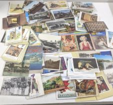 A collection of a variety of postcards to include Marilyn Monroe, train related postcards and others