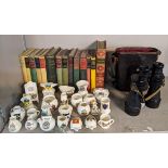 A mixed lot to include a pair of vintage binoculars with case, a collection of books to include '