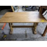 A small light oak coffee table on trestle ends, 46 x 90 x 47, Location:
