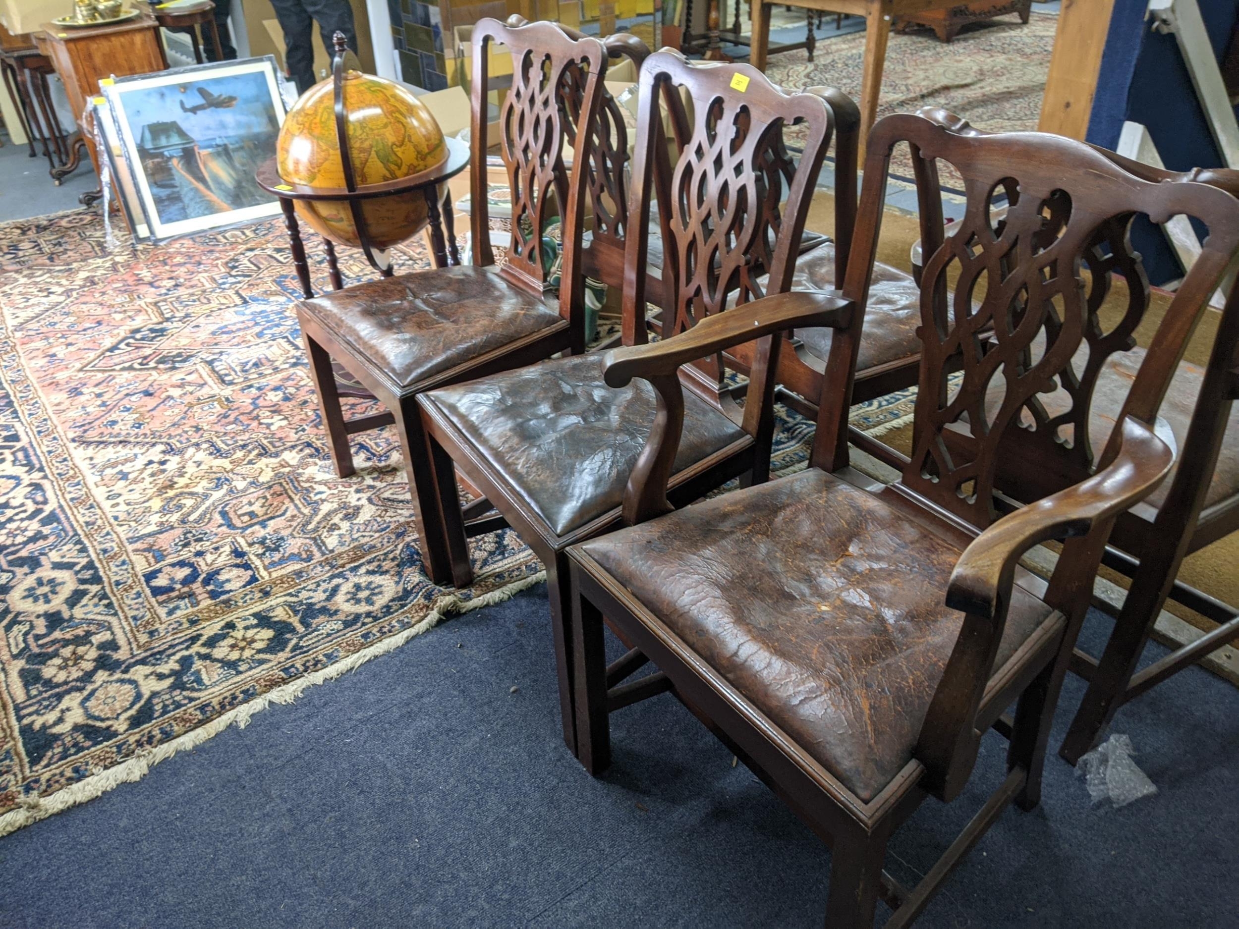A set of six early 20th century Chippendale style dining chairs with overstuffed upholstered seats